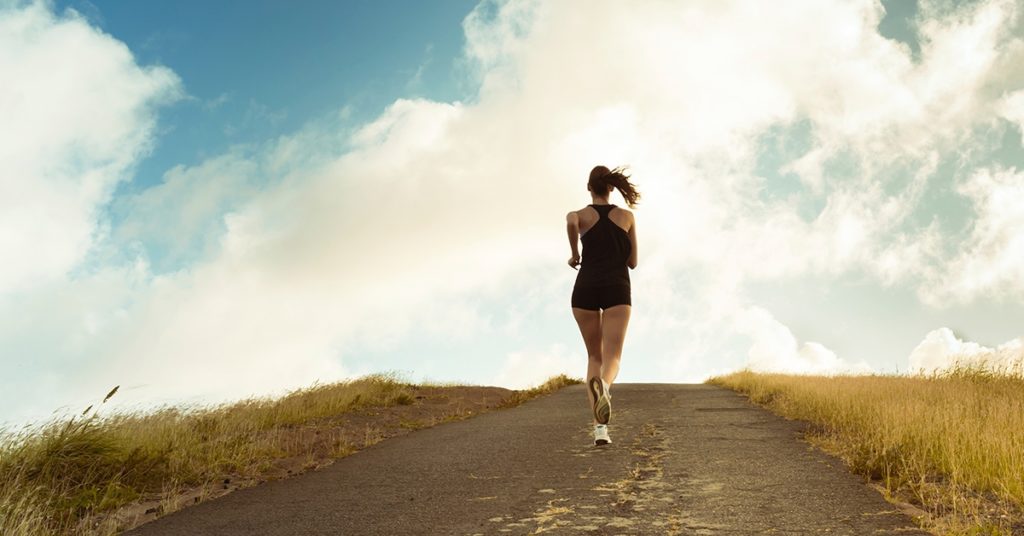 A woman running uphill