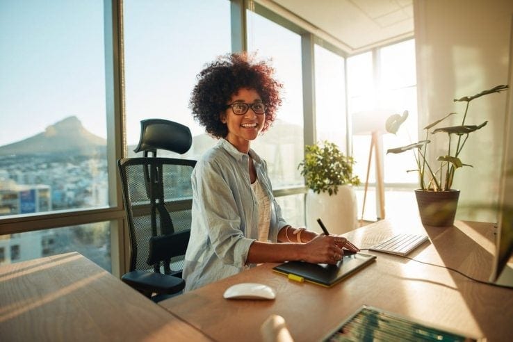 A young woman with good posture sat in her office