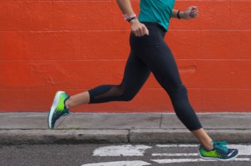 A female runner running down the road
