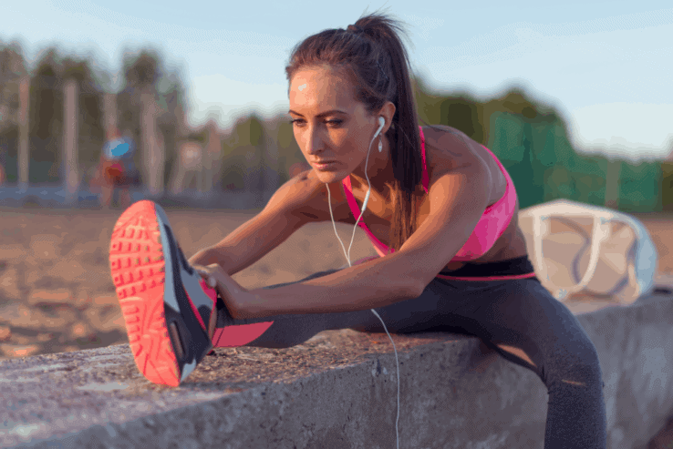A female runner stretching out her hamstrings before she starts to run