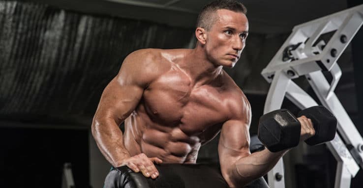 A man doing bicep curls in the gym