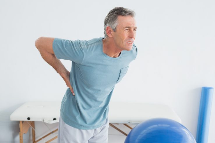 A man in the hospital with lower back pain