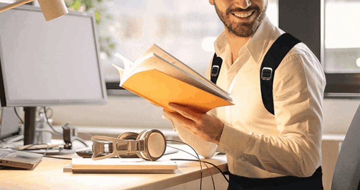 A man smiling while wearing his posture corrector