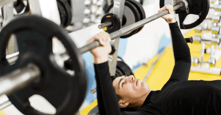 An average build man bench pressing in the gym