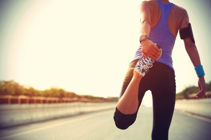 Female runner stretching her legs