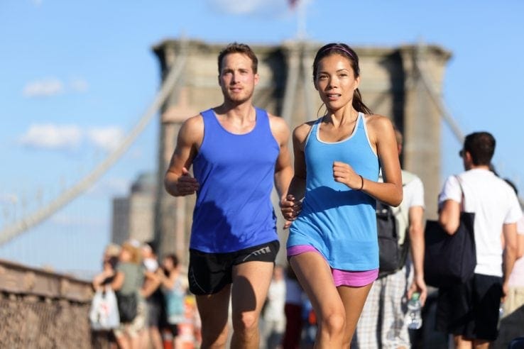 Two young runners running together