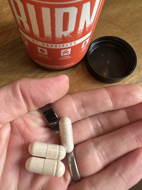 Capsiplex Burn capsules in hand