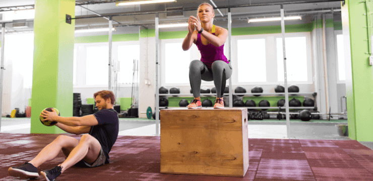 a couple exercising together in the gym