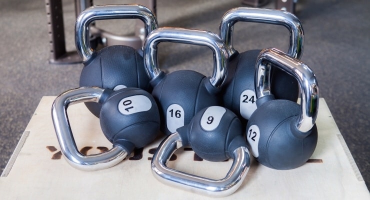 a group of different sizes of kettlebells