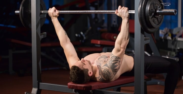man building chest muscles with the bench press