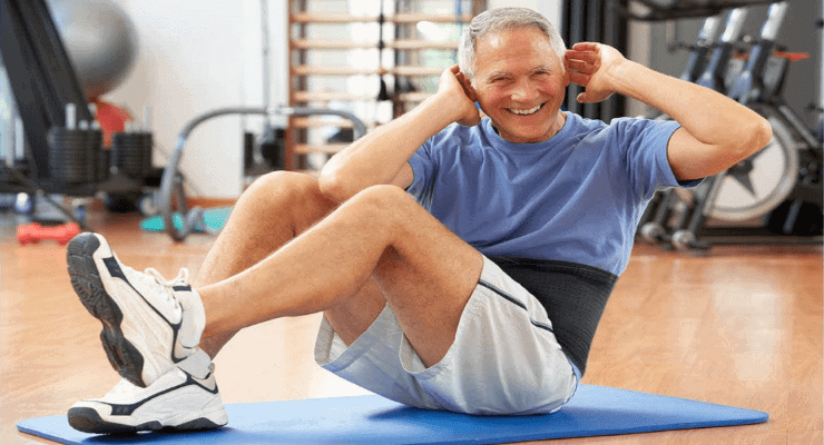 older man wearing a waist trimmer while exercising