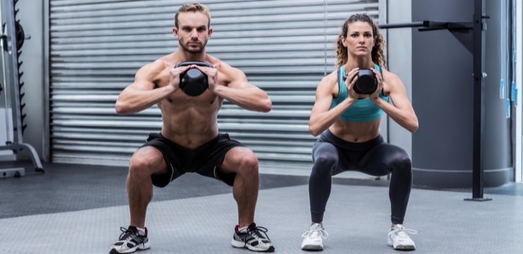 two people exercising with kettlebells